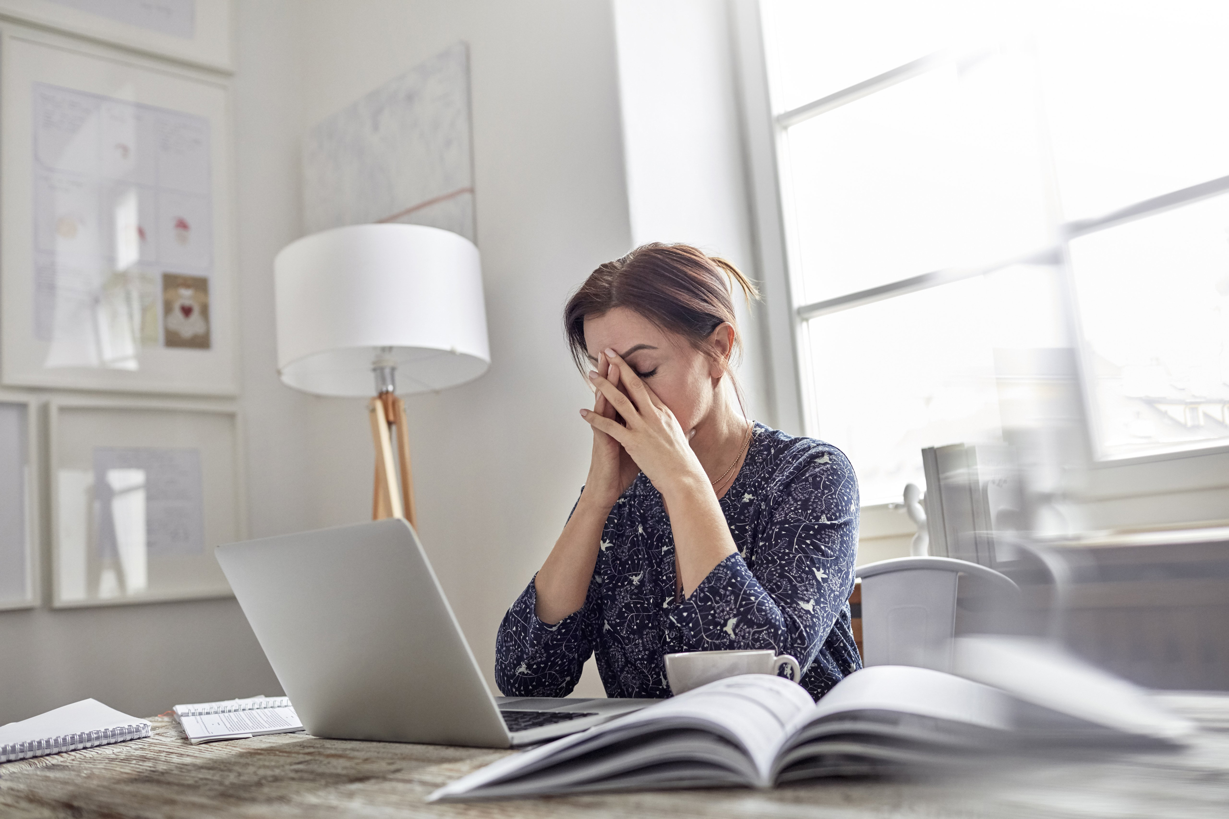 stressed woman at work on a laptop